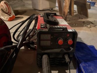 Welding machine with hood.