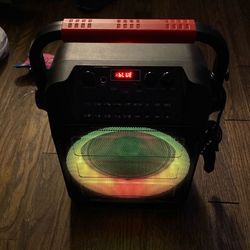 kids karaoke like new with bluetooth sounds  great 2 microphones charger sub lights up asking 40