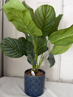 artificial plant in ceramic pot measures 25 inches tall