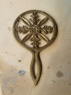 Vintage brass snowflake trivet