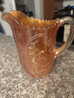 Orange Iridescent Carnival Glass Pitcher with Windmill Design, Glossy Finish