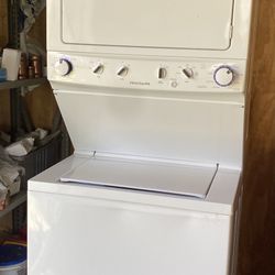 White Electric Washer and Dryer laundry unit 