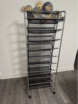 10-tier rolling shoe rack features a silver metal frame and black mesh shelving that holds up to 60 pairs of shoes.