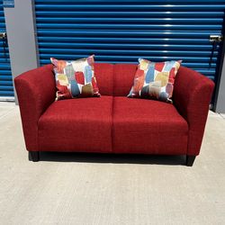 New! Upholstered Loveseat. Bria blaze color with accent pillows. $299