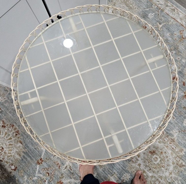 Pretty iron side table with real glass top.