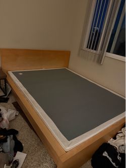 Queen-size wooden bed frame
