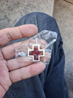 Vintage World War II era American Red Cross uniform or cap pin.