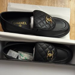 Black leather Chanel loafers