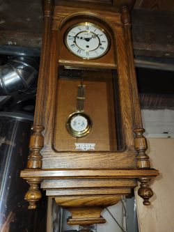 two wall clocks Howard Miller