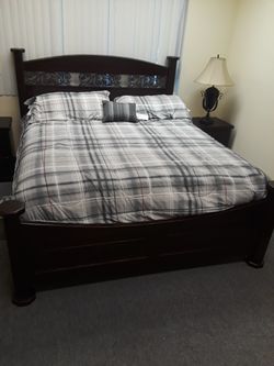 King bed with mattress and comforter