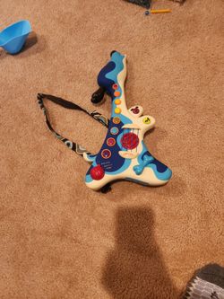 B. Toys Play Intrractive Toy Guitar