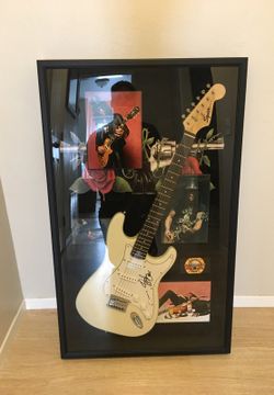 Sign guitar by slash from Guns n Roses.