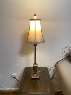 vintage-style bronze finished table lamp with a candlestick base and a fabric empire shade
