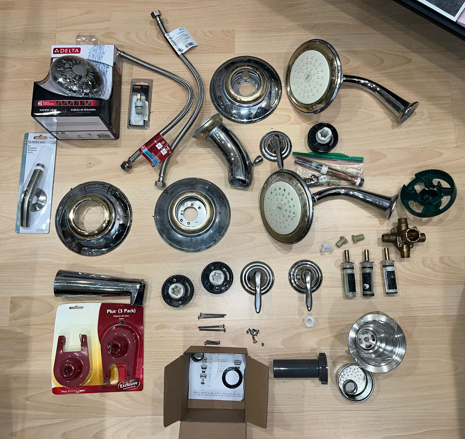 2 Used Moen Shower and 1 Used Moen Bathtub Assembly (all 3 Heavy Metal) - 1 Delta Shower Head (brand new) - Other Parts