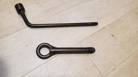 New never used Toyota tire wrench and front tow hook.