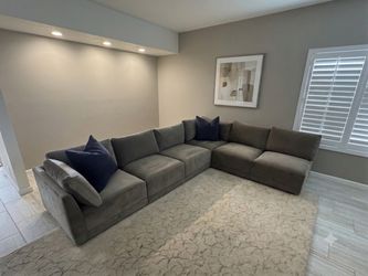 Taupe living spaces modular sectional