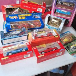 collection of older toy cars in packages
