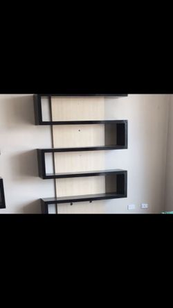 8 foot s shaped large shelving unit.