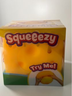 Squeeeezy brand yellow sensory toy for hands-on play. Soft, squishy texture encourages squeezing, poking, and stretching. Bright yellow color is fun a