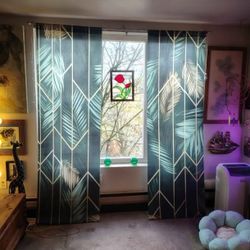 2 PANELS OF GREEN PRETTY CURTAINS 