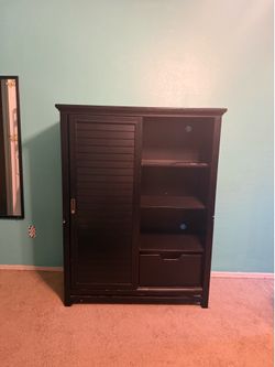 Tall black armoire