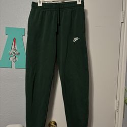 dark green nike sweatpants cuffed