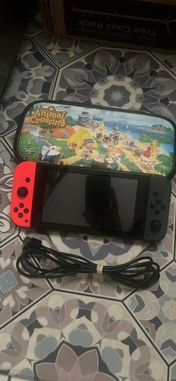 Nintendo Switch with Animal Crossing Case and Cable