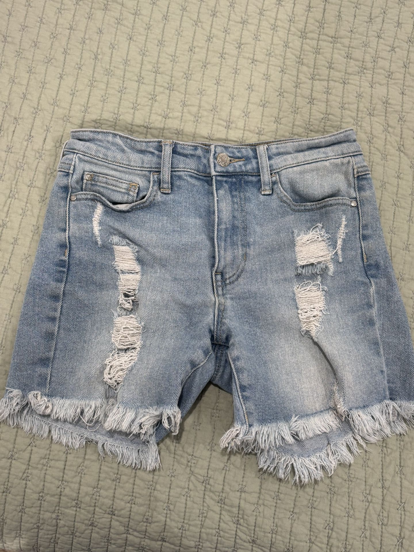 Guess 1981 Midi Jean Shorts in a light blue destroyed denim with a frayed hem