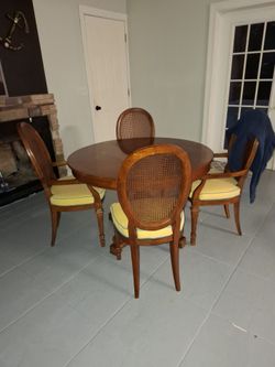 Round Wood Dining Table with 4 Cane Back Chairs