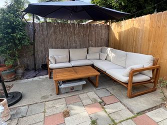 ARTICLE Laholm outdoor sectional with coffee table and cover