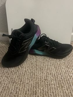 New Balance Women's Black Running Sneakers with Teal & Purple Gradient Sole