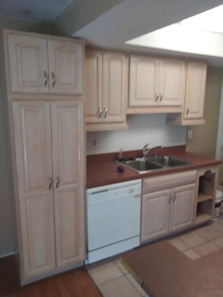 Like new kitchen cabinets stove and hanging microwave