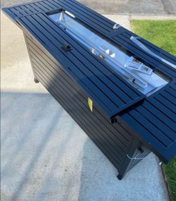 New in box Legacy Heating 56 in. x 23 in. Rectangular Fire Pit Table in Hammered Black