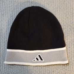Adidas Black with Gray and white accents winter beanie cap/hat.. With Tags inside. 
8" inch tall x 8" inch across. 
Made with 60% Cotton, 40% acrylic.