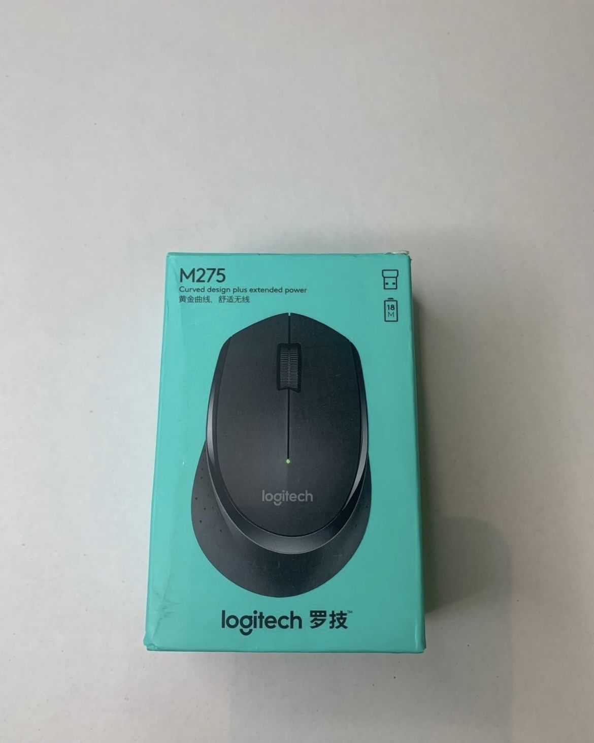 Logitech curved design computer mouse.  (H)