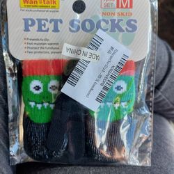 New In Sealed Package.  Pet Socks. Cat Or Dog. Non Slip Socks. With Velcro To Help Keep On. Help Protects Furniture As Well. .