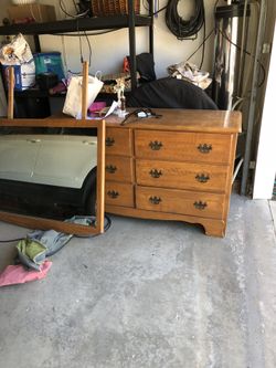 Antique wooden dresser. 6 drawers with vanity mirror that attaches to the back.