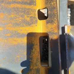 Attachment plates for skid steer