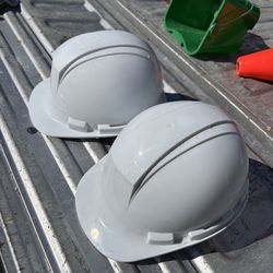 I adjustable size hard hats, two of them