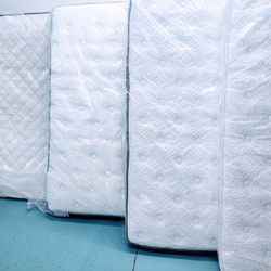 Brand New Mattresses In The Factory Plastic