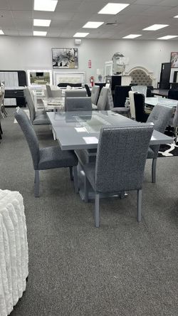 Elegant high gloss grey finish dining set with a clear glass inlay to round off the look