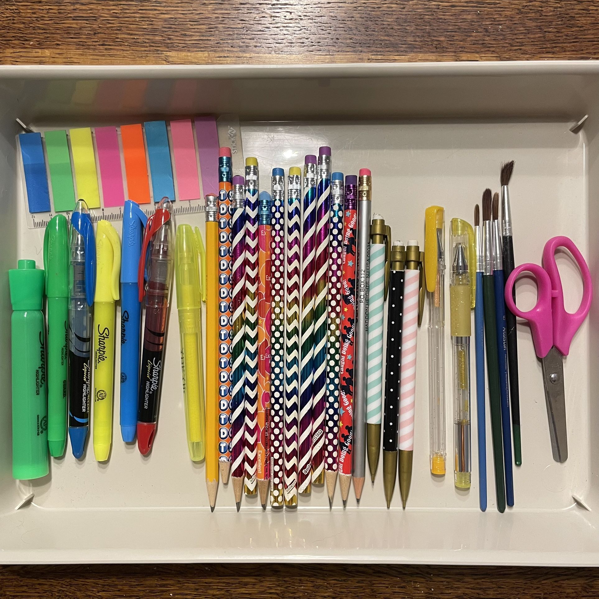 Back to school set: pencils, highlighters, pens, paintbrushes, scissors