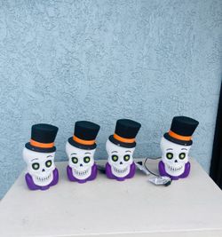 4 Halloween light up skeleton head approx 10” tall