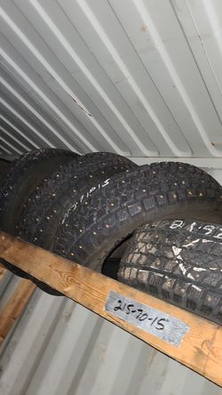 215 70 15 (4) used SNOW STUDDED TIRES free installation and balance