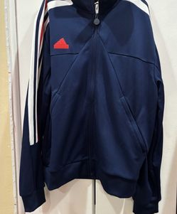 Adidas Men's House of Tiro Nations Pack Track Jacket in the colorway Team Navy Blue 2 / White / Better Scarlet