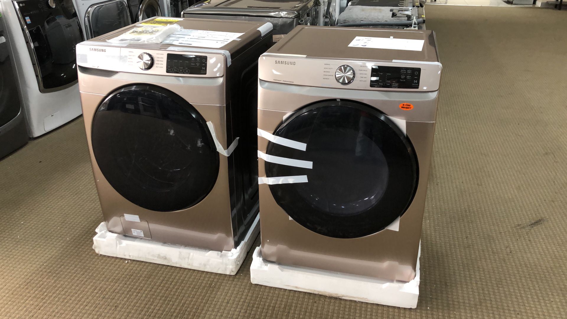 Brand new rose gold Samsung front load washer and dryer set. $39 down!
