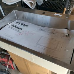 Kraus 30-in stainless steel kitchen sink with faucet and screen. 