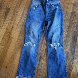 Daze blue jeans with frayed hem and distressed details size 26" waist