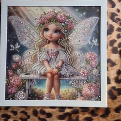 Little Fairy Sitting On A Bench 