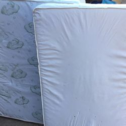 2 Portable Crib Mattresses  And 2 Full Sz Matresses. New One 40 $ Other In Good Shape 20$